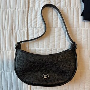 Lacoste Woman’s Black Pebbled Lether Half Moon Shoulder Bag